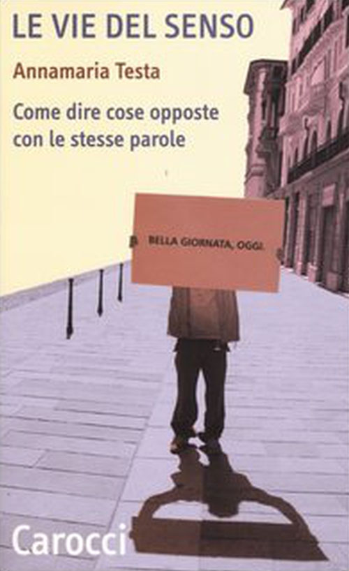 Copertina libro Le vie del senso, con uomo che mostra cartello con su scritto "bella giornata oggi"