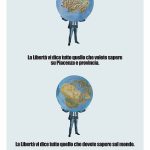 Due uomini che reggono un grande mappamondo. Titolo: la libertà vi dice tutto quello che che dovete sapere sul mondo.